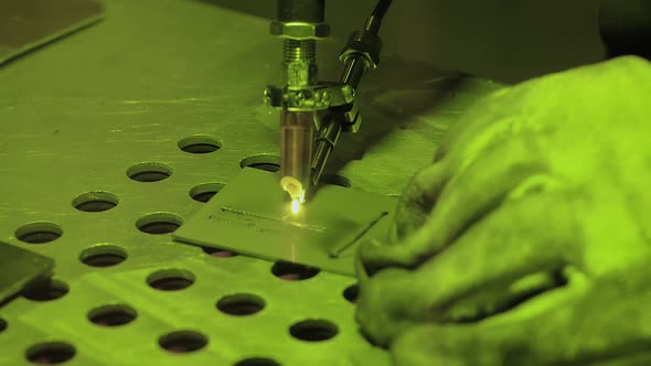 Welder Hands Using Handheld Laser Welding Machine  Slow Motion Close Up