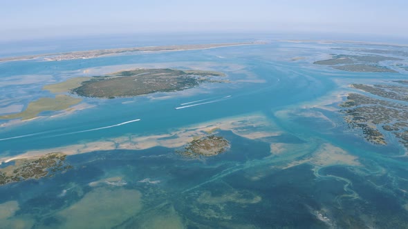 Aerial View of Faro district Lagoon in Portugal, Europe in the Ocean 4K