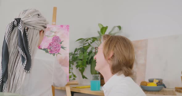 The girl with the bionic hand is working in a studio Bionics Cybernetic Robotic-arm Hand prosthesis alt