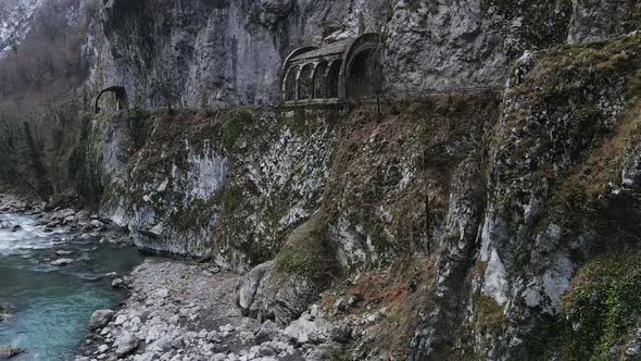Abandoned Old Dangerous Road in a Narrow Gorge Along the Mzymta River alt