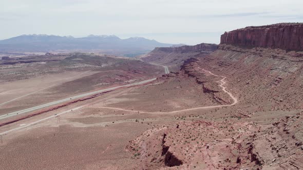 Panorama Of Desert Road With Scenic Red Sandstone Cliffs In Moab, Utah USA. Aerial Wide Shot alt