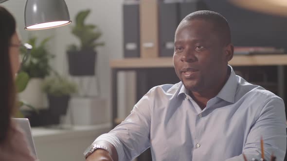 Cheerful Afro-American HR Manager Posing for Camera at Work alt