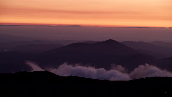 Clouds over mountain peak, Portugal. Timelapse alt