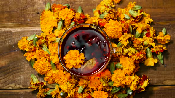 Top View Red Tea From Marigold Flowers, Tea For Colds. Naturotherapy Drink From A Flower. Homeopathy