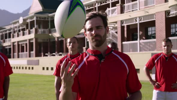 Male rugby players standing with rugby ball in the rugby ground 4k