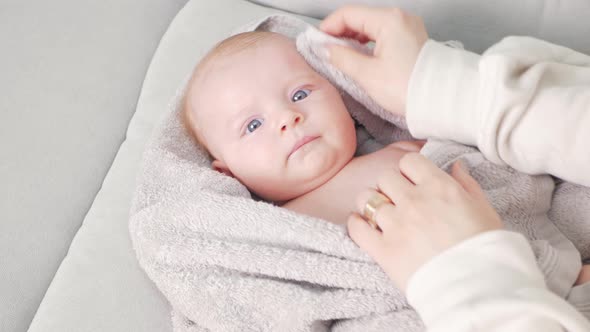 Mom Wipes Baby with Towel After Bath Relaxation Little Baby Girl Love and Care