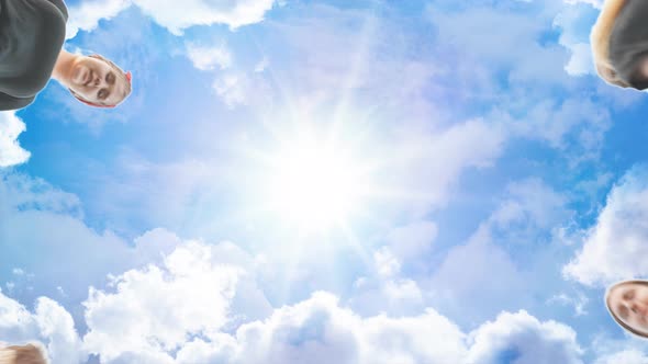 Friends Join Their Hands By the Wrist and Make a Circle Against the Backdrop of a Fabulous Sky alt