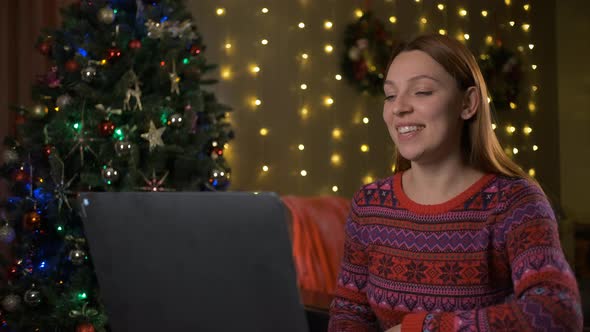On Christmas Eve Woman is Talking on Video Call
