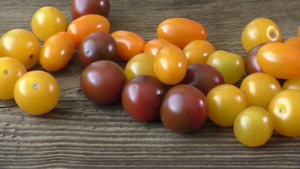 Cherry tomatoes on rustic wooden background