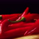 On Wood Plank Ripe Red Long Hot Chili Peppers are the World&#39;s Number One Culinary Delight and Cash - VideoHive Item for Sale