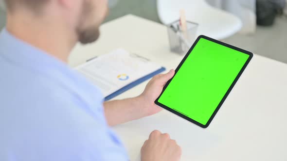 Young Creative Man Using Tablet with Chroma Screen alt