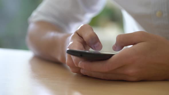 Man using smart phone alt