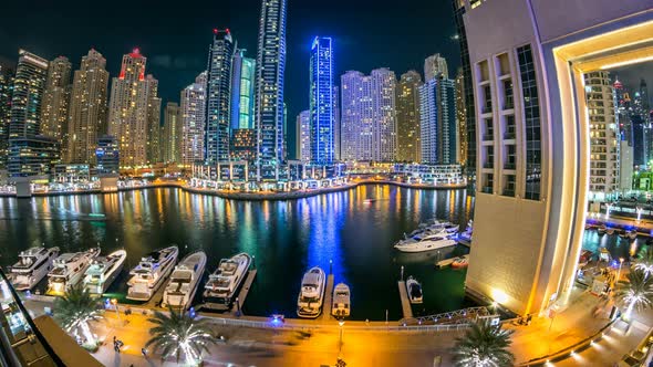 View of Dubai Marina Towers and Yachts in Canal in Dubai Night Timelapse alt