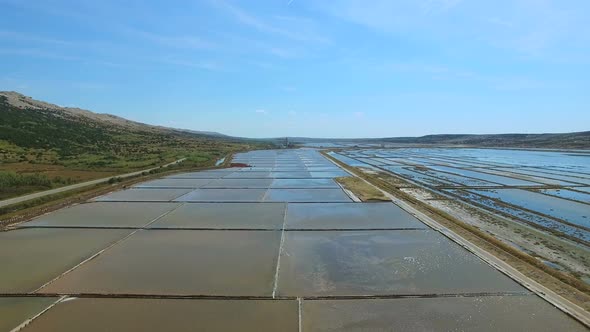 Flying above salt evaporation ponds on Pag island, Croatia alt