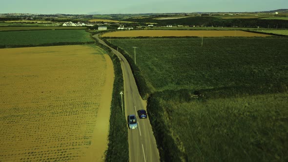 The car is moving on a country road. Outside the city through the fields. timelapse