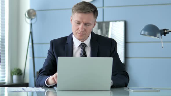 Businessman Leaving Office alt