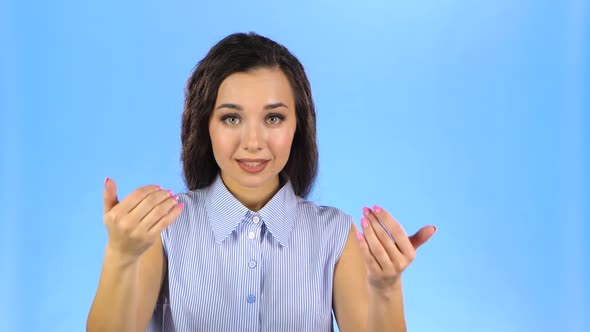 Young Female Is Waving Hand and Inviting To Come To Her. alt