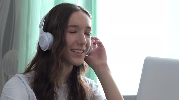 The Happy Girl Communicates Remotely Through the Internet alt