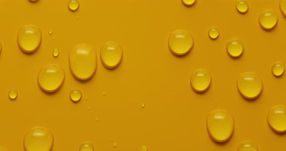 Abstract water drops on yellow background, macro, Bubbles close up