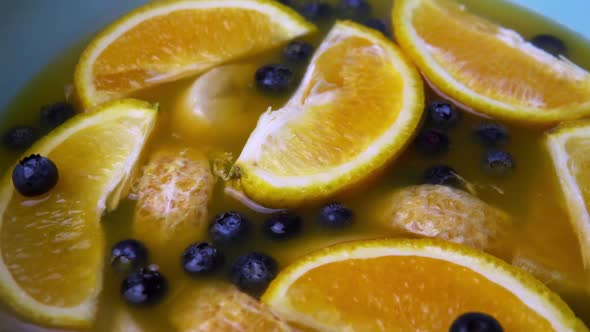 Summer Fresh Drink with Ripe Fruits in Blue Bowl