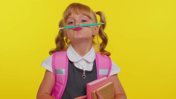 Funny Joyful Kid Primary School Girl Making Playful Silly Facial Expressions Fooling Around with Pen alt