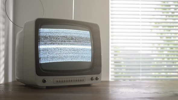 Vintage television displaying noise on the screen