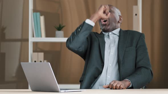 African American 60s Businessman Mature Man Boss in Office Has Work Break Listen Music with Laptop alt