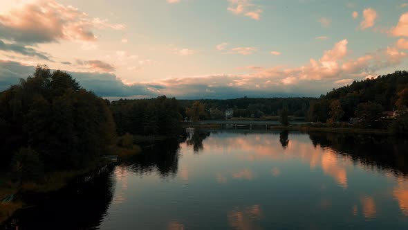 Panoramic View Of Tleń With Calm Water and Trees - Aerial Shot alt