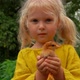 Beautiful Little Girl in Yellow Linen Shirt Holds in His Hands a Little Chicken - VideoHive Item for Sale