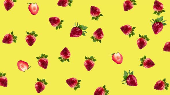 many fresh red strawberries wiggle close-up on a yellow background