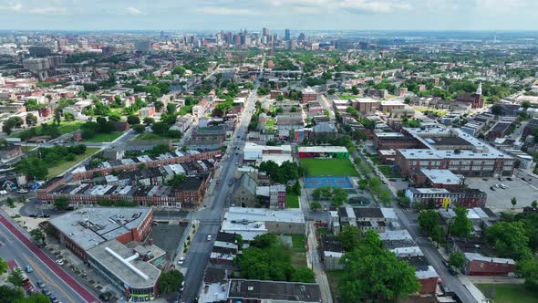 Urban American city lifestyle housing and homes truck shot. Downtown skyline in distance. alt