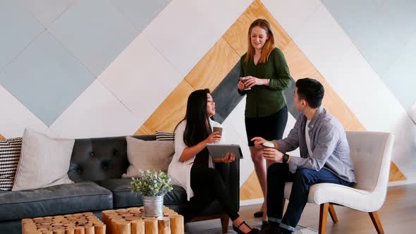 Business people discussing over digital tablet in a modern office 4k alt