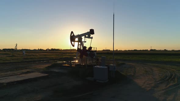 Fuel Production, Oil Pump, Pumping Oil in Field, View From Height, Sunset Light. alt