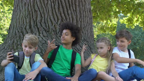 Adorable Multiracial Friends Posing for Smartphone Photo Having Fun Together