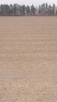 Vertical Video of a Field with Plowed Land in Autumn Slow Motion alt