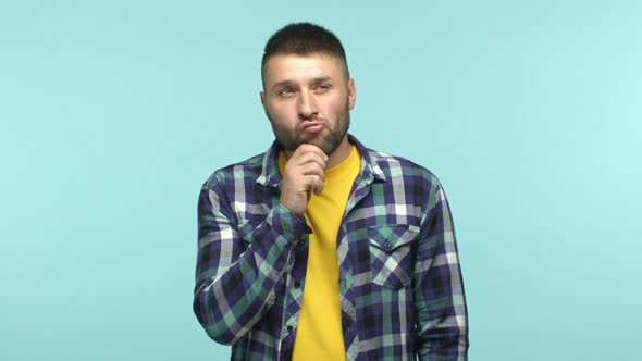 Slow Motion of Handsome Caucasian Man Standing Pensive Pucker Lips and Touching Beard Thoughtful alt