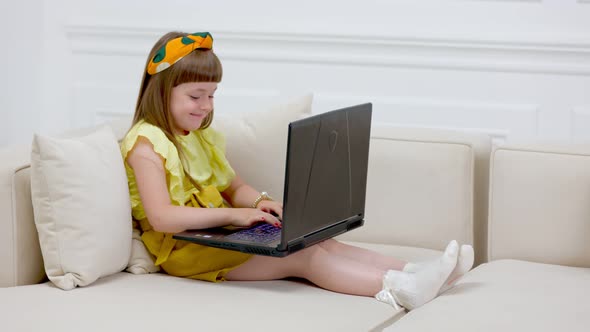 Rebecque Looking at Laptop alt