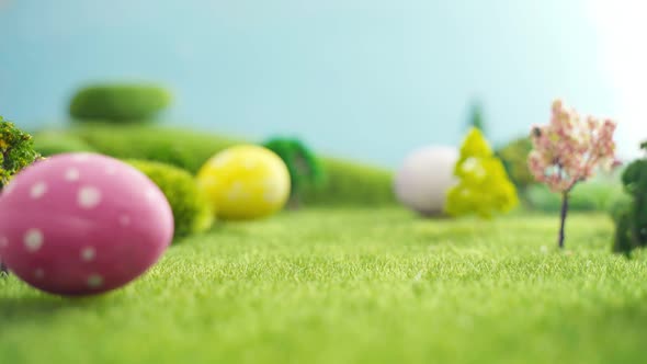 Hand Laying Easter Egg on Grass in Fairytale Fictional Macrocosm alt