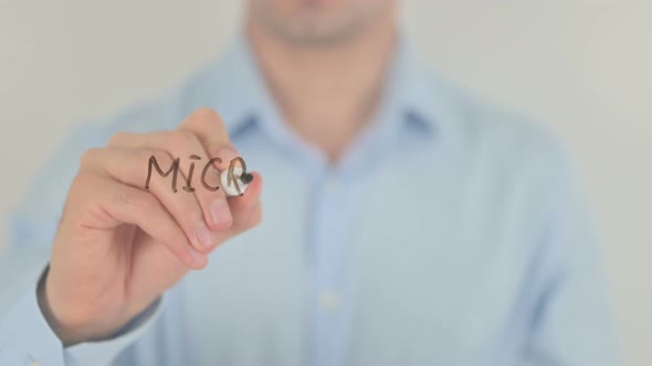Micro Credit System, Man Writing on Transparent Glass Screen alt