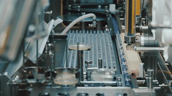 Conveyor for the Production and Bottling of Medicines Against Viruses and Bacteria. Pharmaceutical alt