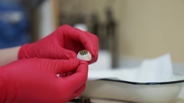Making of ocular prosthesis. Close up view of making human eye prosthesis alt