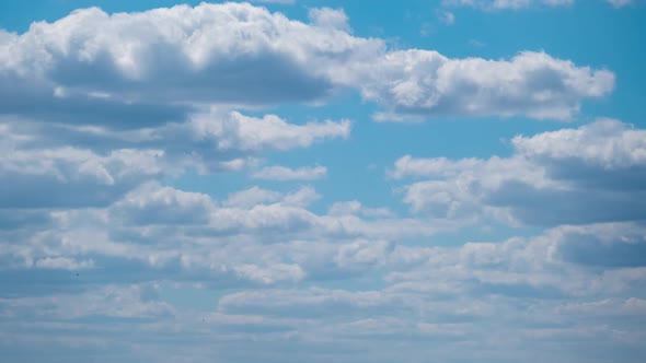 Cumulus Cirrus Clouds Move in the Blue Sky. Time Lapse. alt