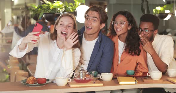 Joyfull Colleagues Posing for Selfies While Spending Good Time During Lunch. Millennial Happy alt