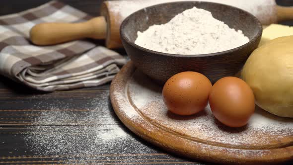 Unrolled and Unbaked Shortcrust Pastry Dough Recipe on Wooden Background alt