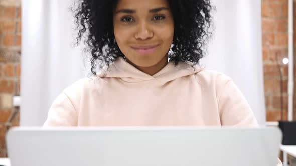 Yes By Young AfroAmerican Woman Shaking Head to Agree at Work alt