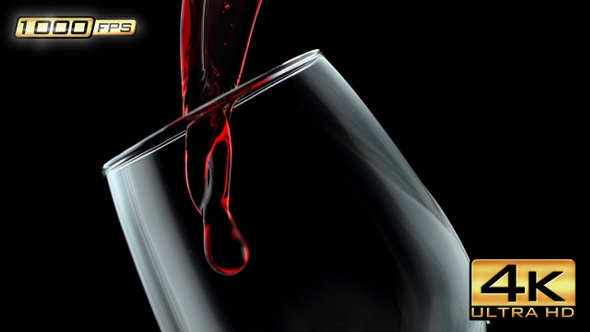 Pouring Red Wine into the Glass