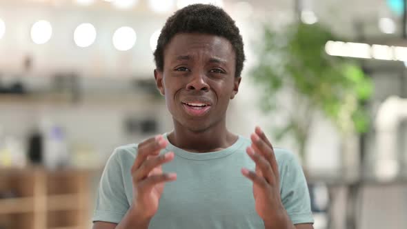 Disappointed Young African Man Reacting to Loss Failure alt