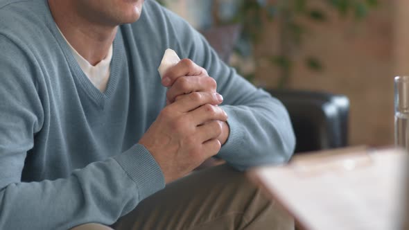 Emotional Man Talking in Therapy Session alt