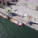 Aerial Flying Above Two Old Port Cranes Towards Boats Docked In Port - VideoHive Item for Sale