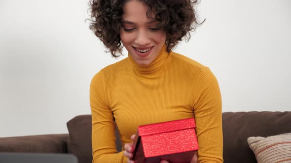 Close Up Happy Woman in Party Hat Opens Red Gift Box and Surprised Birthday alt